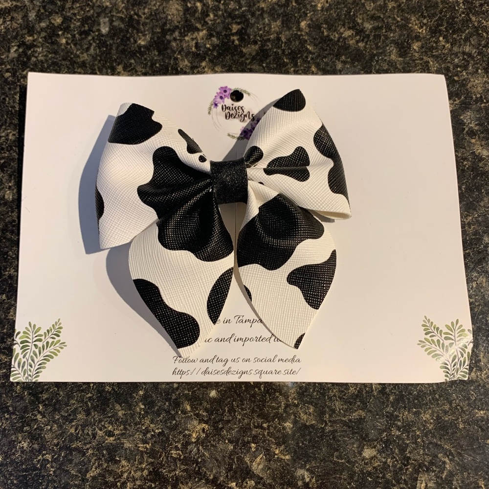 Handmade Bow Fun Kicky Black & White Cow print leather like with long clip 4”x4”